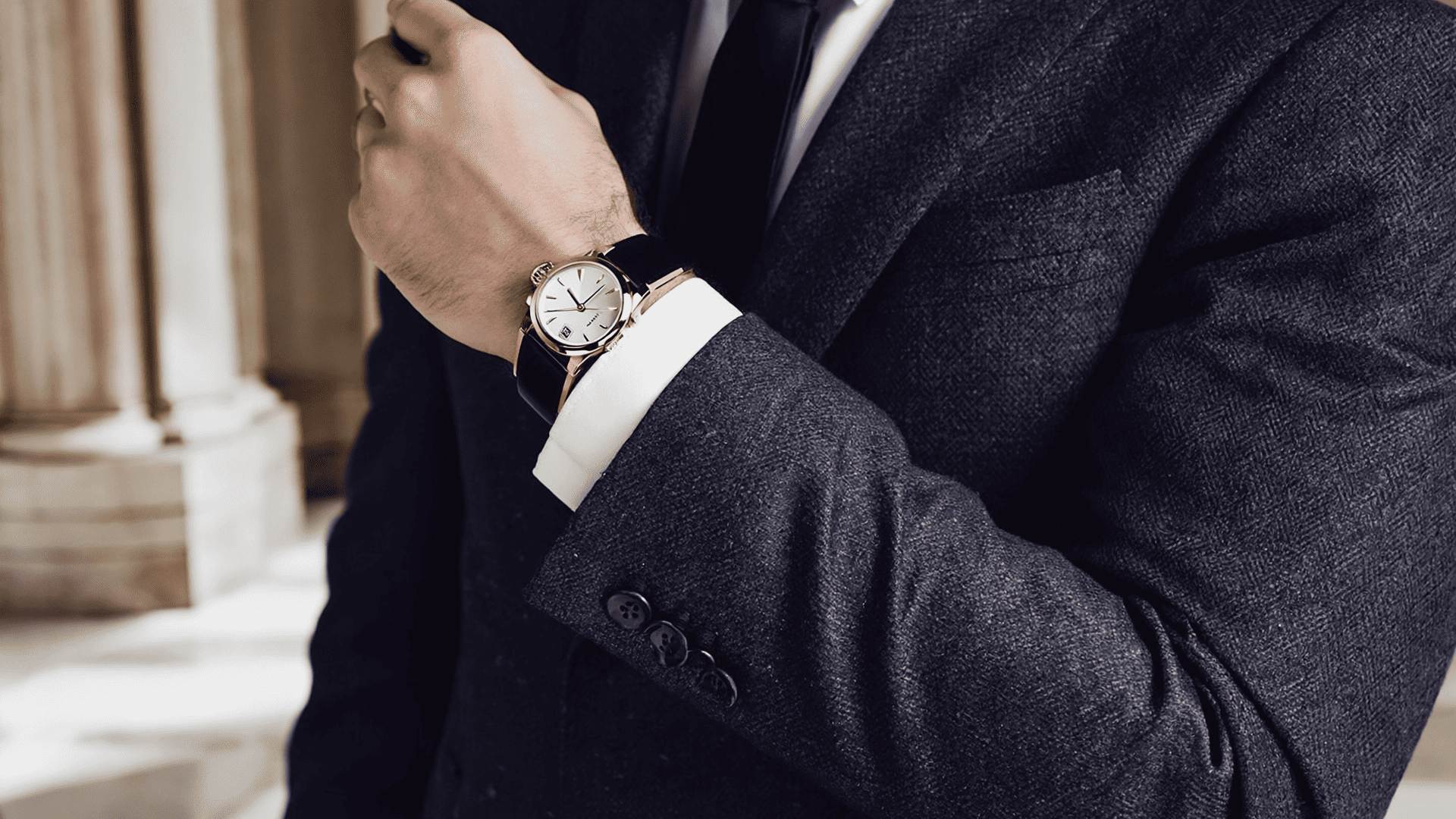 formal men's suit with an elegant dress watch and polished refined styling